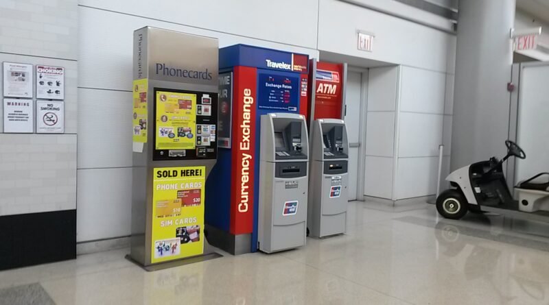 Airport currency exchange and ATM area for comparing exchange costs