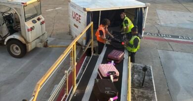 Airport luggage being loaded for an article about hidden vacation costs