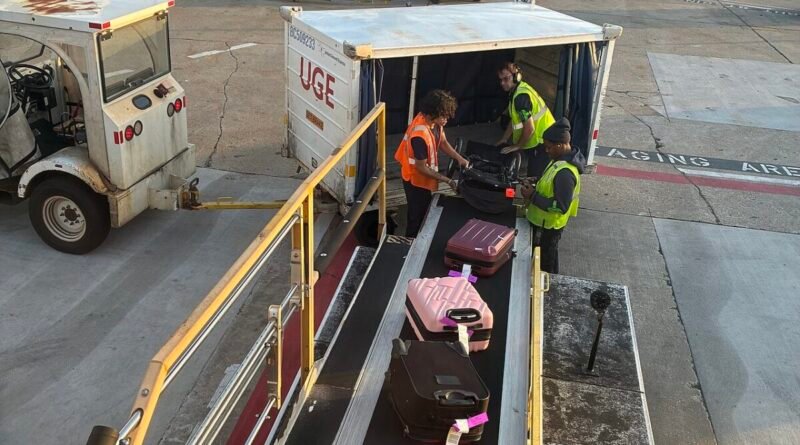Airport luggage being loaded for an article about hidden vacation costs