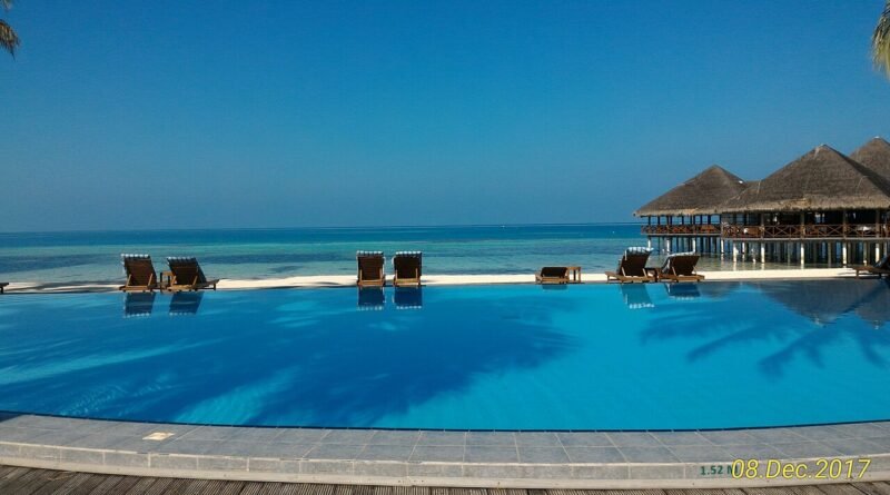 Resort swimming pool for an article about hotel resort fees and all-in pricing