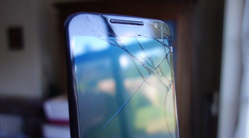 Cracked smartphone screen for an article about whether phone insurance is worth it