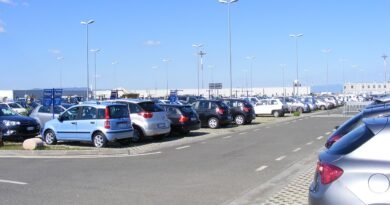 Rental cars parked at an airport for an article about rental car insurance coverage
